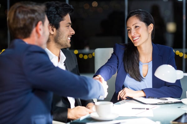 Businessman shaking hands with a colleague in the office