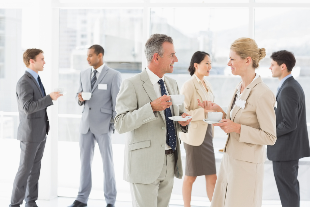 Business people chatting at a conference in the office